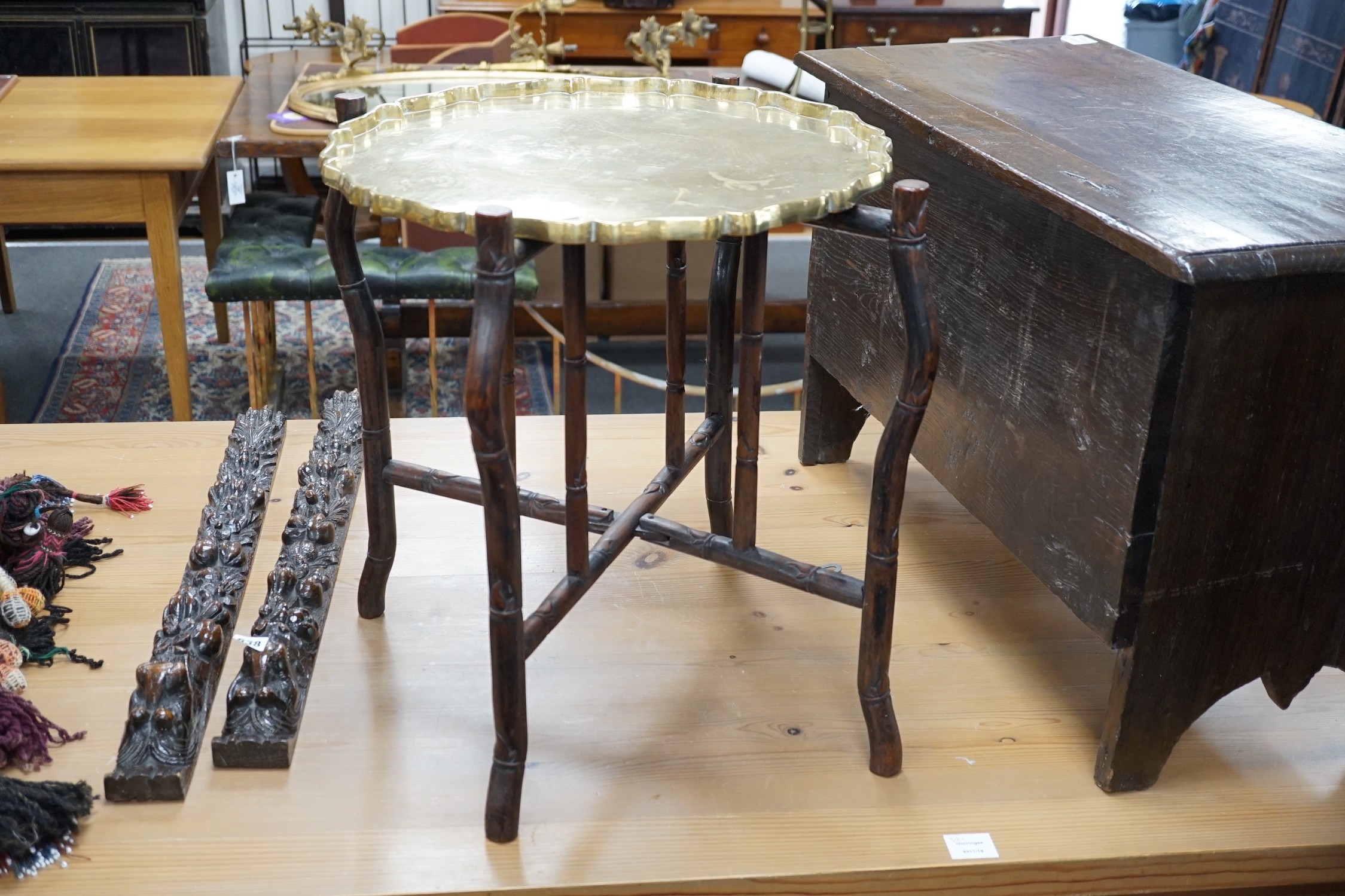 A Chinese brass tray topped hongmu folding occasional table, diameter 56cm *Please note the sale commences at 9am.